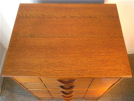 A Heals style golden oak five drawer chest W.56cm